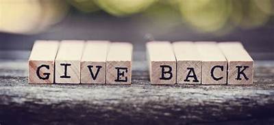 scrabble letters that say give back, Shop T.K.S supports and donates to the community