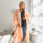 Woman wearing Orange and pink leopard print beach cover up, Shop TKS