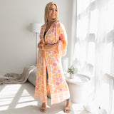 Woman wearing pink and orange beach cover up with belt, Shop TKS