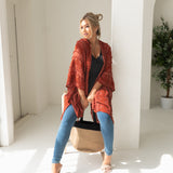 Woman wearing orange sweat for Fall with black bamboo tank top, jeans, bamboo jute handbag, Shop T.K.S