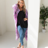 Woman wearing purple tie dye beach cover up, Shop TKS