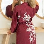 close up of back of burgundy women's floral robe
