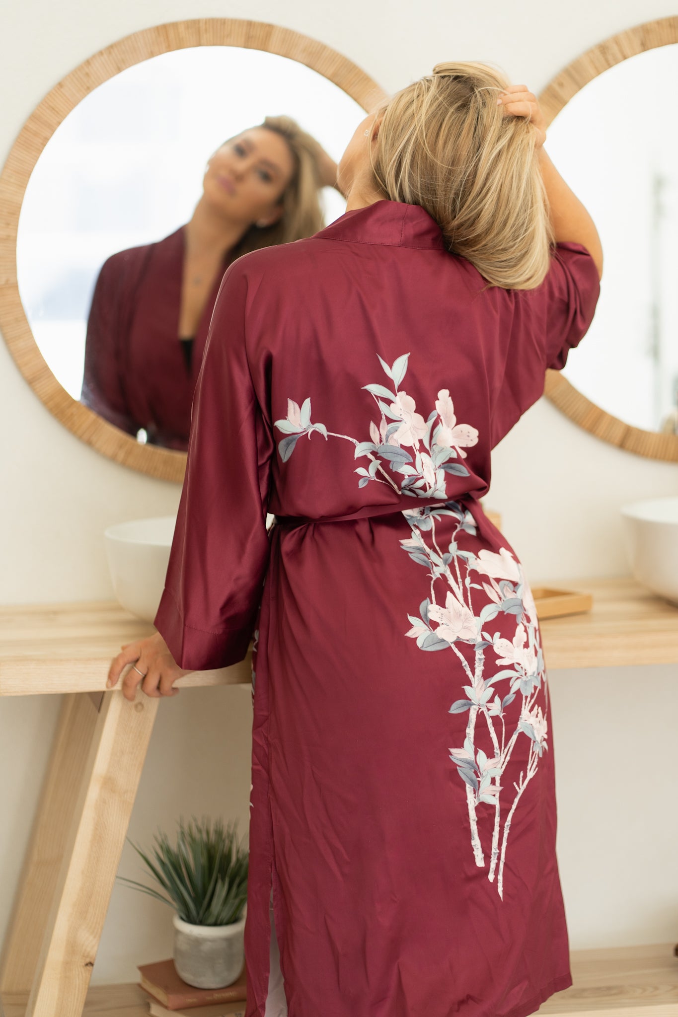 close up of back of burgundy women's floral robe