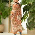 Woman wearing boho orange and cream print beach cover up, Shop T.K.S