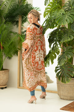 Woman wearing boho orange and cream print beach cover up, Shop T.K.S