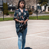 Woman wearing navy blue floral short beach cover up and bamboo tank top with jeans, Shop TKS