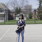 Woman wearing white and navy blue floral beach cover up, Shop TKS