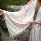 Close up of women's kimono sleeve robe with florals, Shop T.K.S