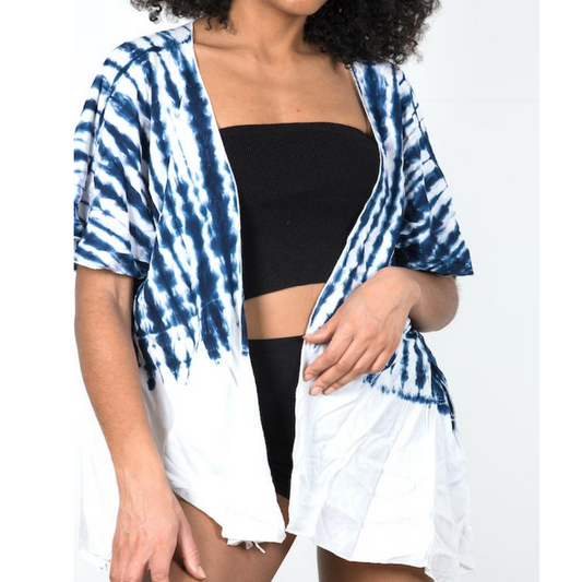 Woman wearing black bamboo crop top and white and blue short beach cover up, Shop TKS