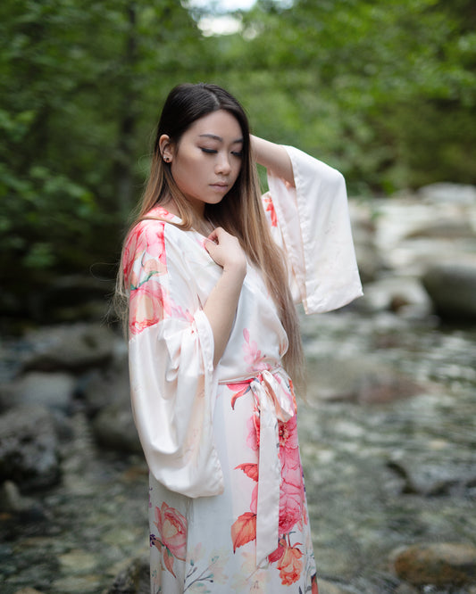 woman wearing pink floral robe for mother's day gift guide presents, Shop T.K.S