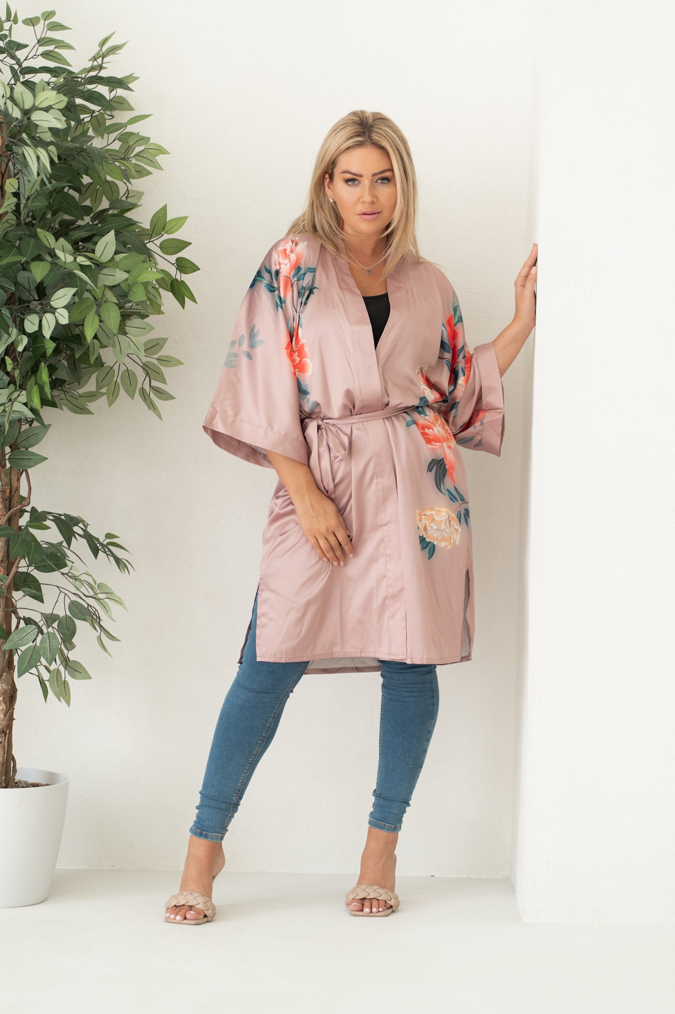 woman in tied pink kimono and loungewear