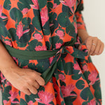 Woman's closeup of pink and green waterlily organic cotton print robe, Shop TKS