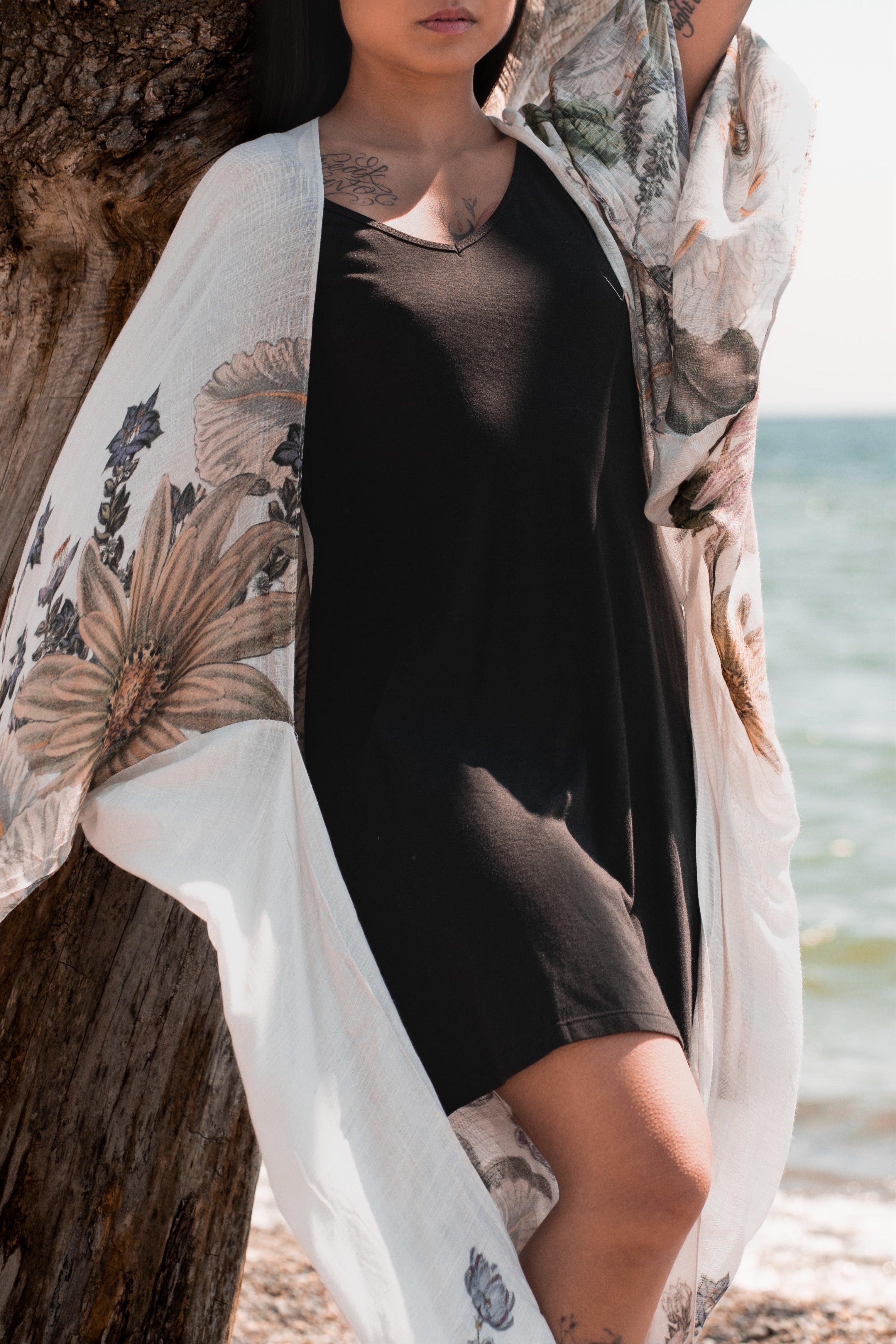 Woman wearing black bamboo dress with spaghetti straps