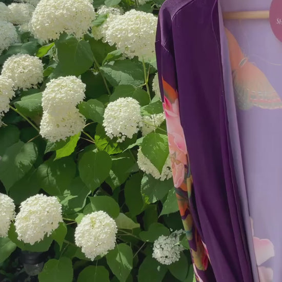 Video of purple floral Jasmine robe in front of hydrangea garden, Shop TKS