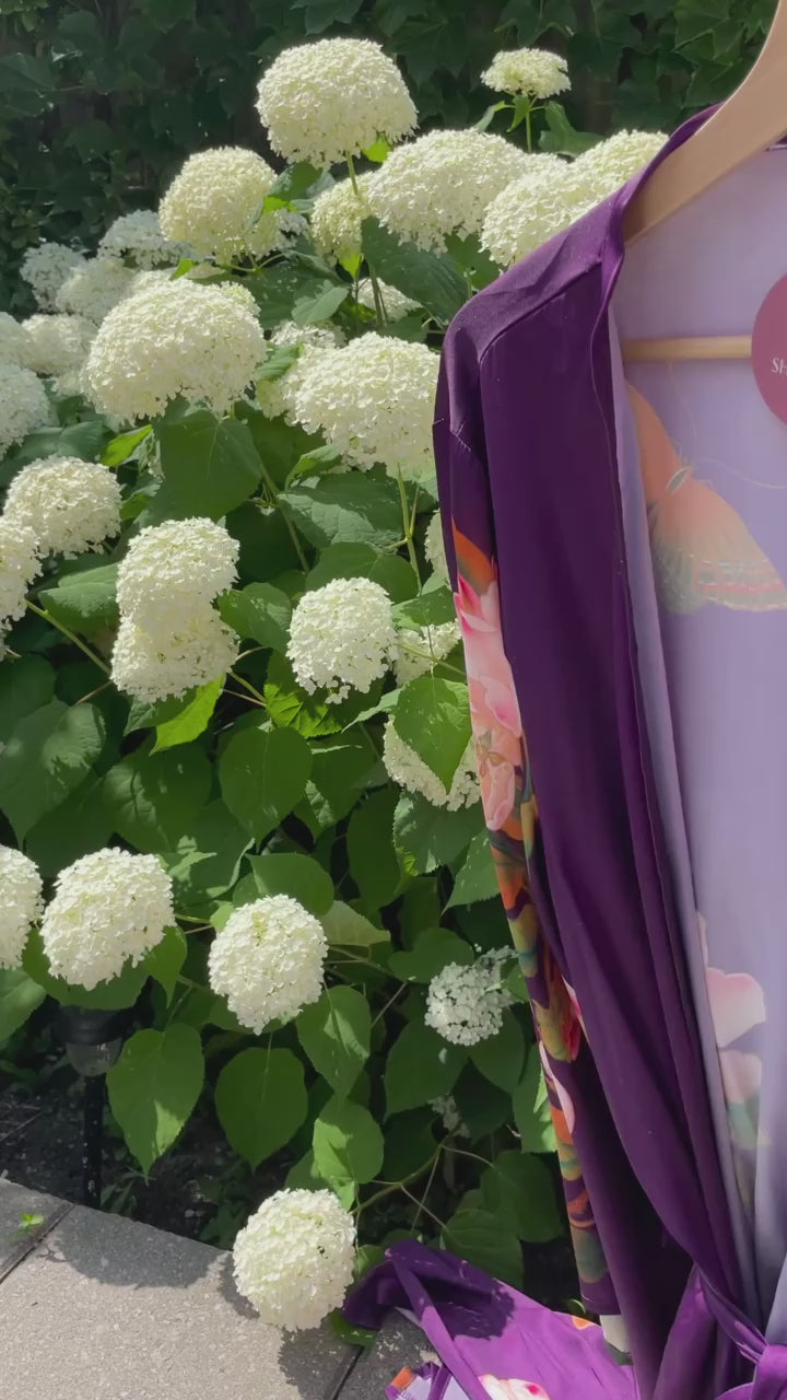 Video of purple floral Jasmine robe in front of hydrangea garden, Shop TKS