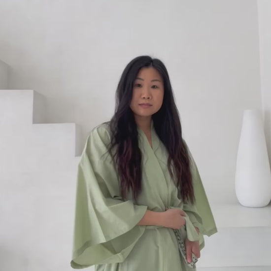 video of woman posing in green kimono